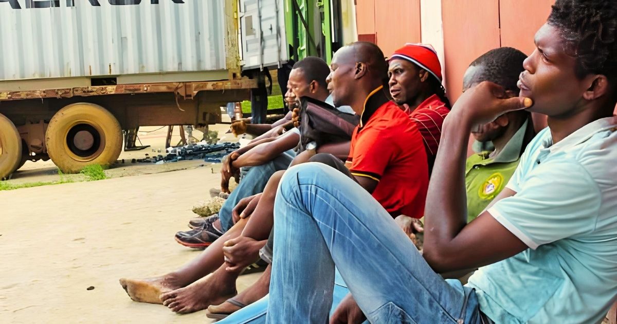 Young men sitting idle highlighting the youth unemployment crisis in Ghana and the need for wealth creation through entrepreneurship.